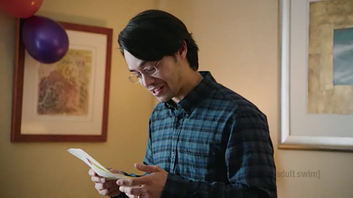Jordan Mendoza as David, grinning as he reads his Hogwarts letter at a birthday party
