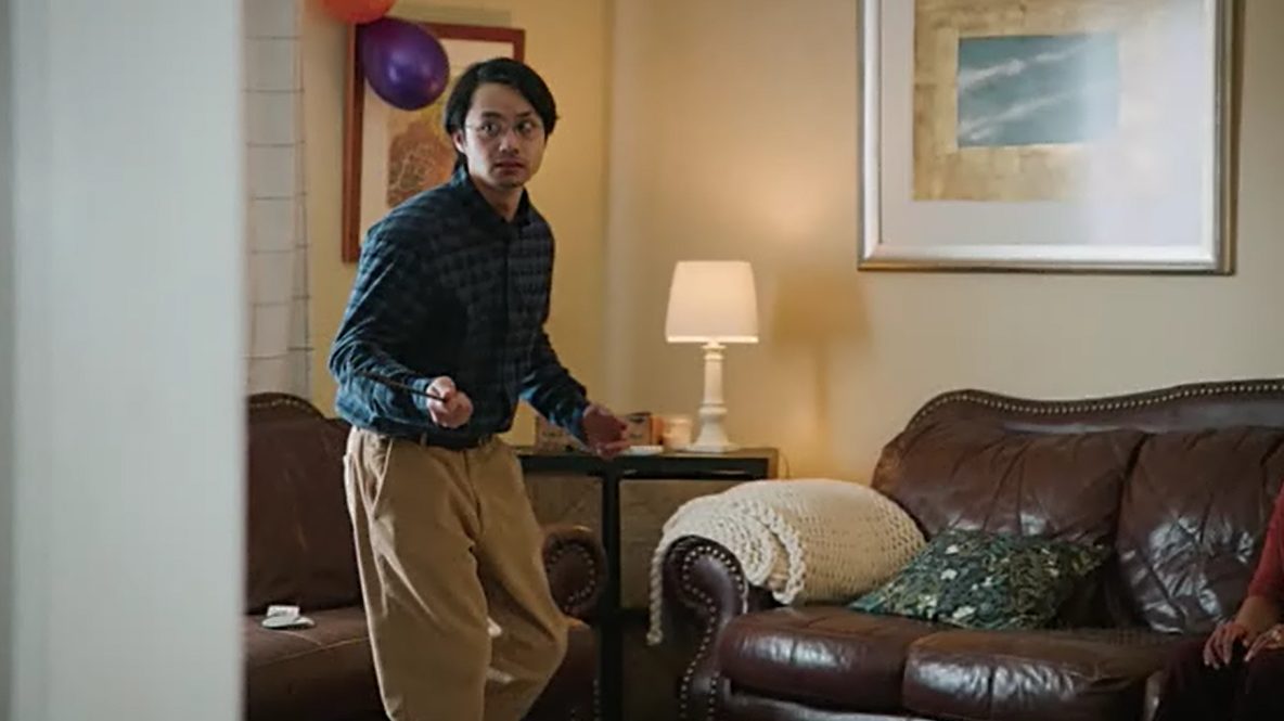 David holding a wand in the living room during his meltdown