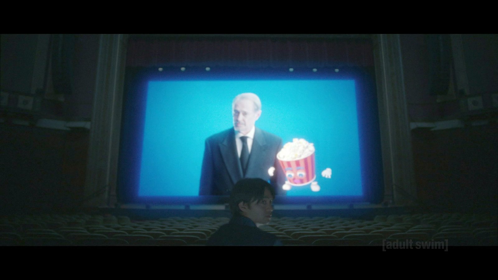 Jordan in a theater watching Steve Buscemi. 