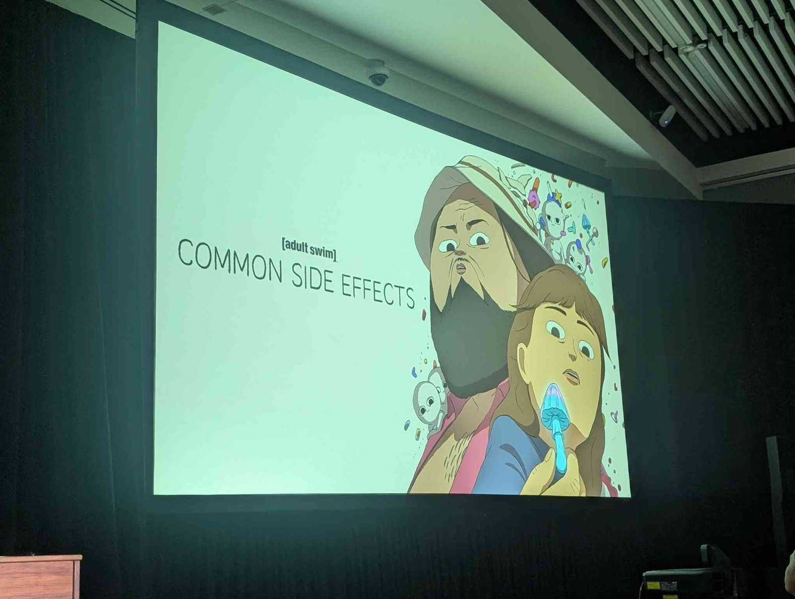 Common Side Effects title card on screen at the NYCC 2026 panel