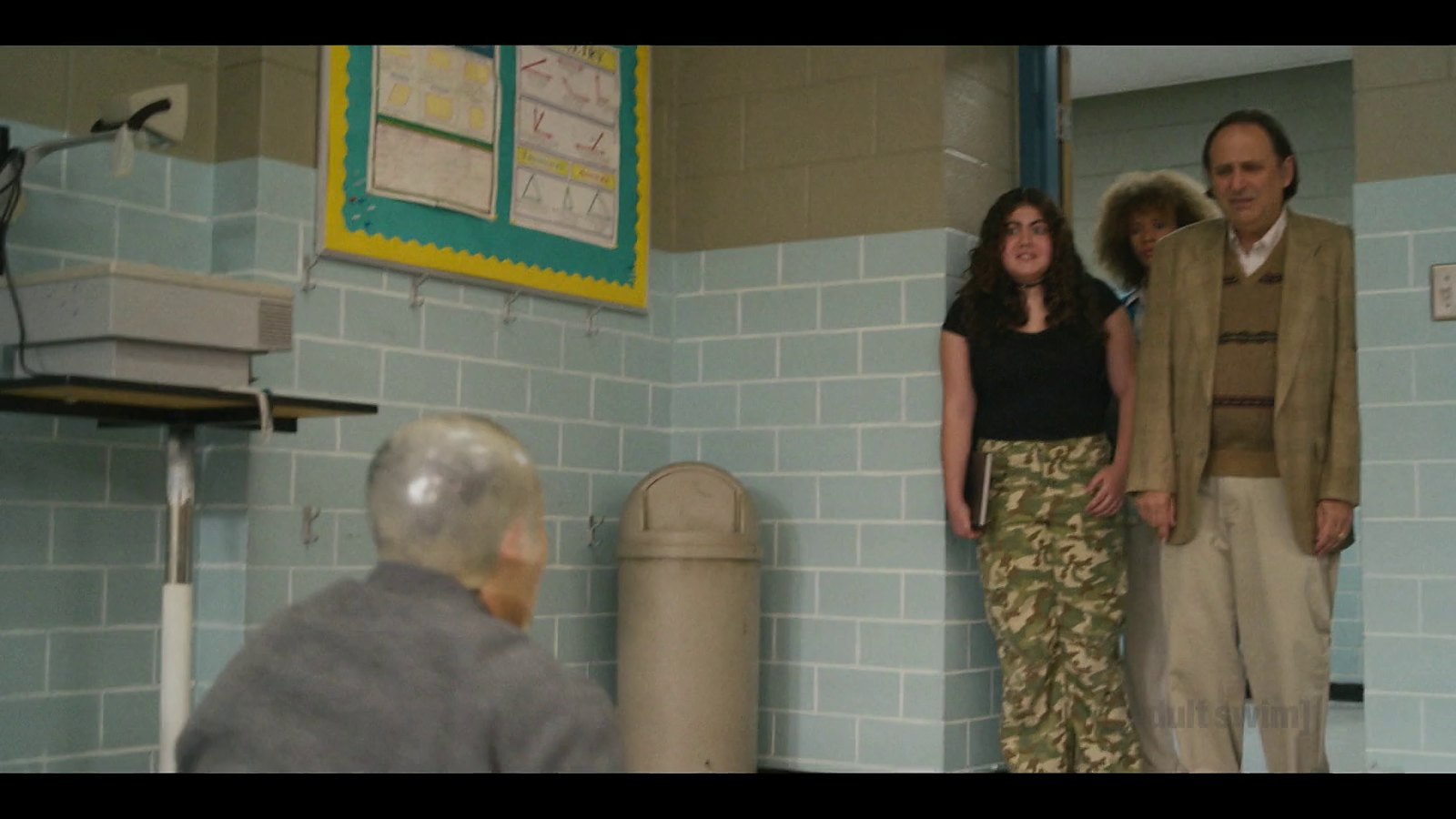 Jordan Mendoza at the front of a classroom as students react